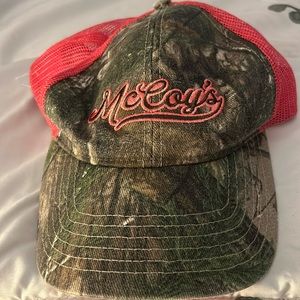 McCoy’s building supply women’s pink and camouflage hat with adjustable strap.